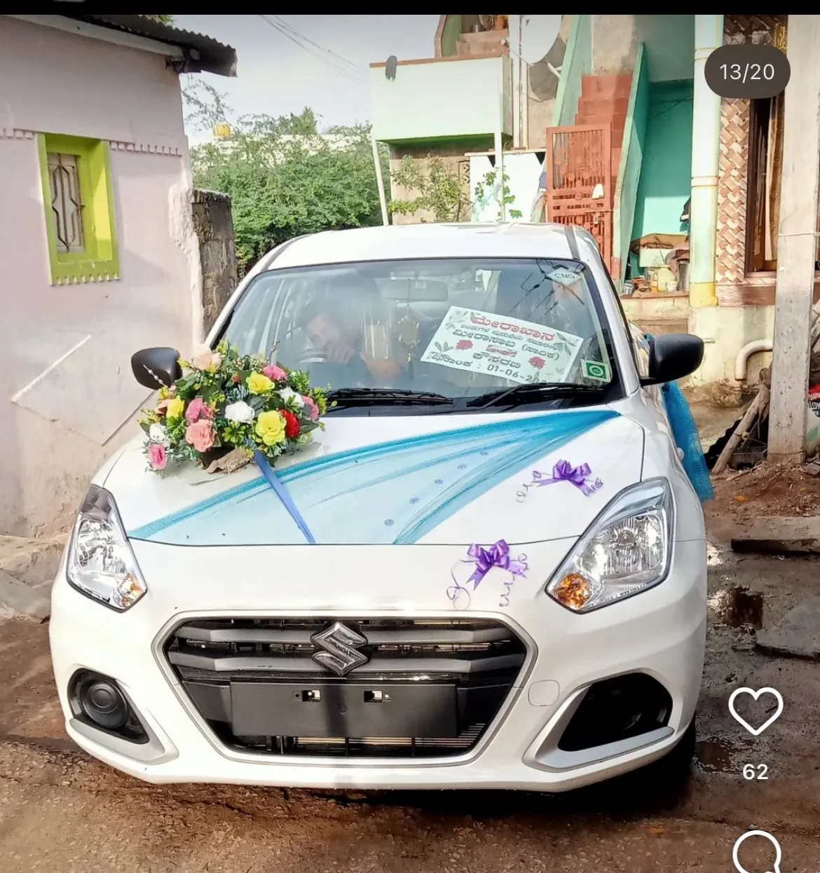 Blue Suzuki with red roses and yellow flowers