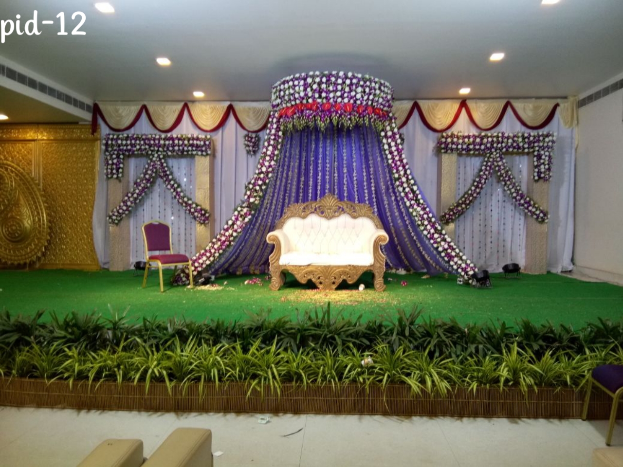 Wedding stage with curtain backdrop and flower decorations - Design PID12